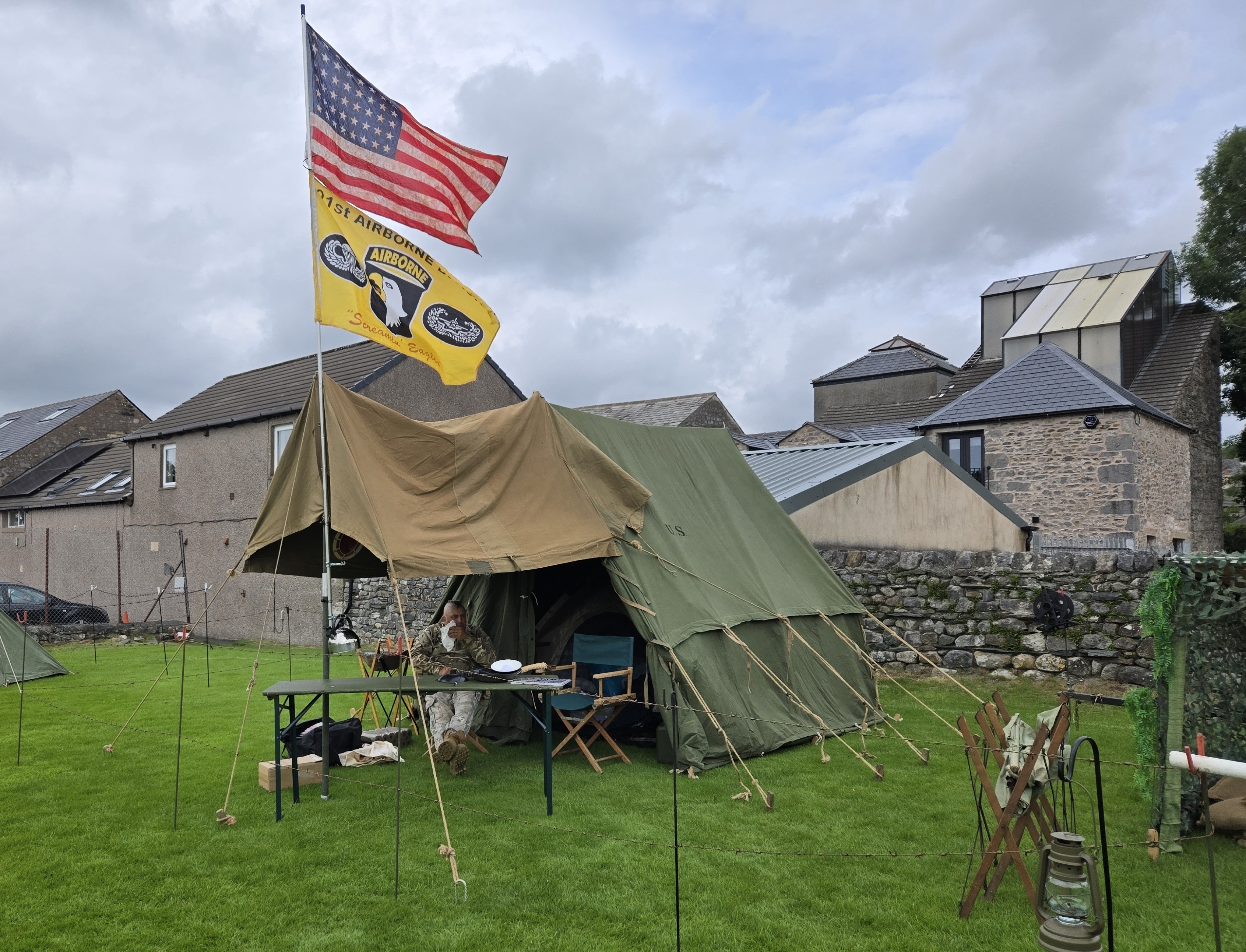 military field display - tent flying American stars and stripes flag