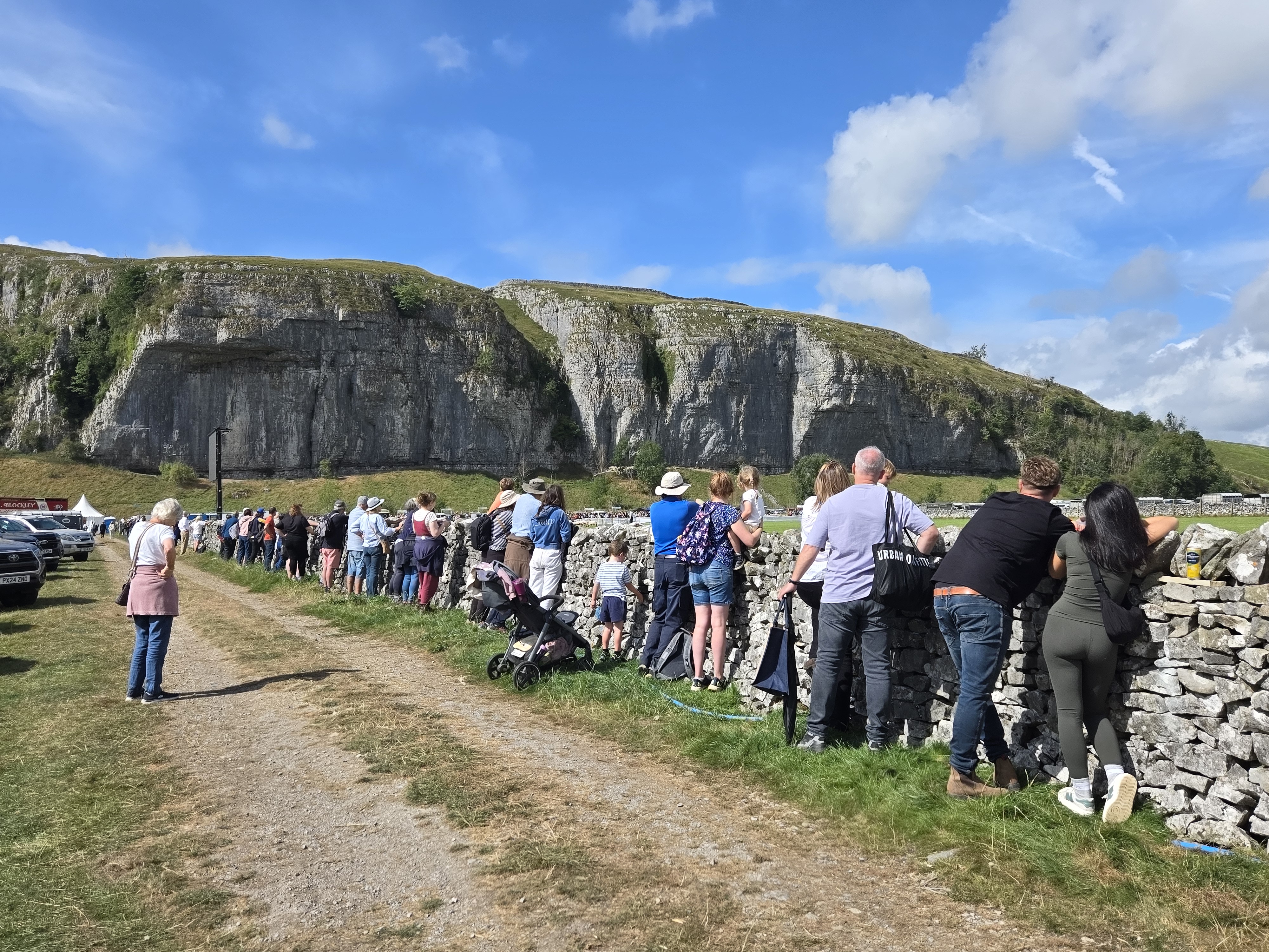 Spectators watching sheepdog trials at Kilnsey Show